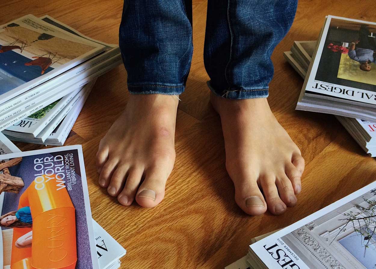 mans feet with mags nearby